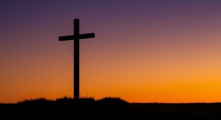 A wooden cross stands on a hill silhouetted against a dramatic sunset sky in shades of orange, purple, and red, symbolizing faith, hope, and spiritual reflection in nature.