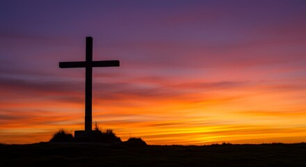 A wooden cross stands on a hill silhouetted against a dramatic sunset sky in shades of orange, purple, and red, symbolizing faith, hope, and spiritual reflection in nature.