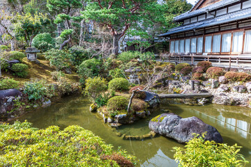 Pond and lush greenery in Yoskhikien Garden in Nara, Japan. 

