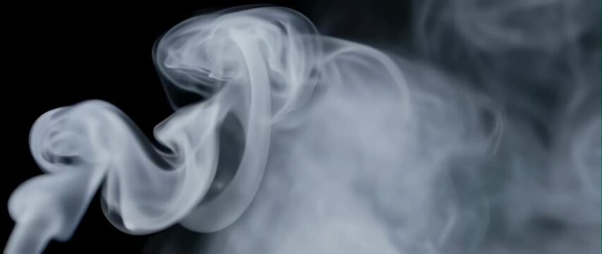 Anamorphic video of cigar smoke effect on black background 