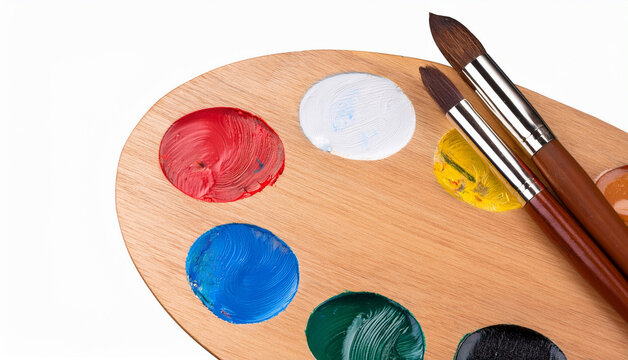 Wooden Palette with vibrant colors and paintbrushes