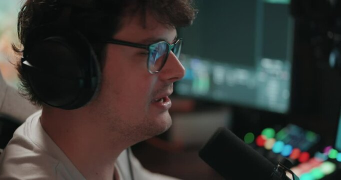 Young man playing video games and setting up a livestream