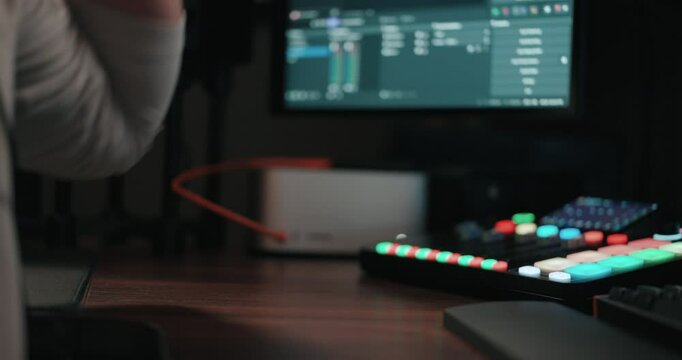 Young man playing video games and setting up a livestream