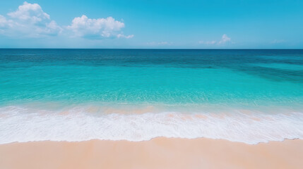 Fototapeta premium Calm turquoise beach with gentle waves and clear blue sky creates serene atmosphere