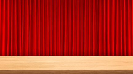 An empty wooden table with a red curtain as a background.