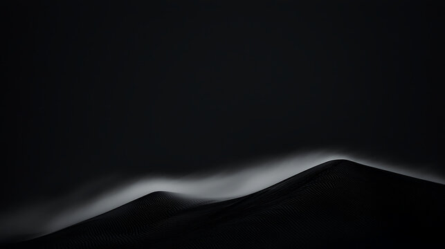 A black and white photo of a mountain range with a dark sky