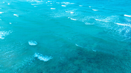 Title Nature of the beach and sea Summer with sunshine, sandy beaches, clear blue waters sparkling against the blue sky. On an island with good ecology and environment Background for summer vacation	
