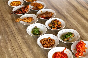 Typical Minangkabau food served on a table in a restaurant