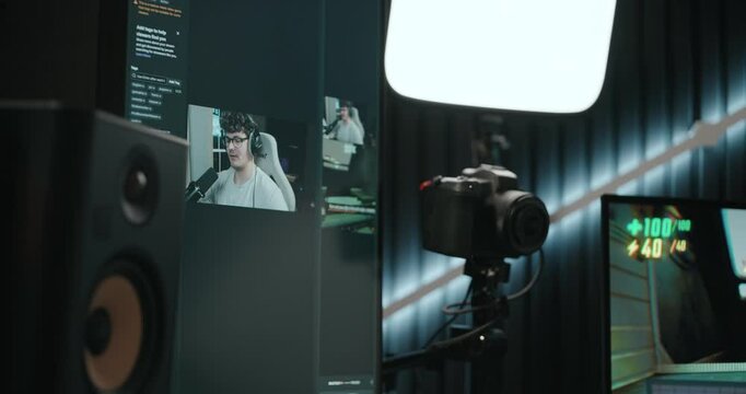 Young man playing video games and setting up a livestream