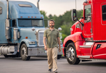Trucking owner. Transportation vehicles. Hispanic man in front of truck. Semi trucks vehicle. Man...