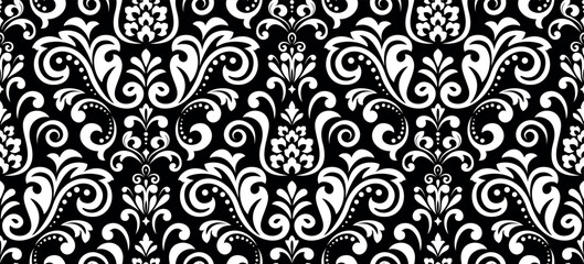 Wallpaper in the style of Baroque. Seamless vector background. White and black floral ornament. Graphic pattern for fabric, wallpaper, packaging. Ornate Damask flower ornament.