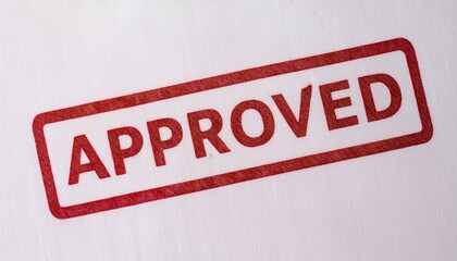 A red "APPROVED" stamp on a white background, indicating validation or endorsement.
