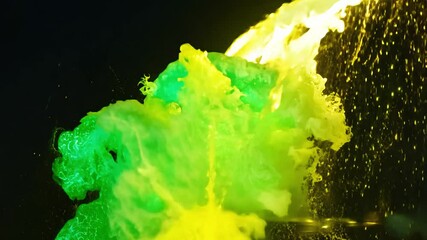 Tilt-down of a vibrant collision of green flames and yellow water jets striking dynamically, colored gel lighting with green and yellow accents - Powered by Adobe