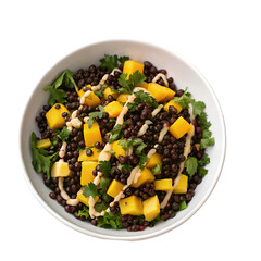 Black lentil salad with mango and tahini dressing top view isolated on white background