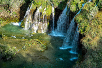 Beauty Waterfall in the Plitvice Lakes in Croatia. The waterfalls in forest. Summer view of...