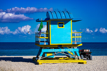 Miami pier. Iconic lifeguard tower on Miami Beach. Scenic view of Miami Beach coastline. Famous South Beach lifeguard. Tropical paradise in Miami. Art Deco lifeguard on Miamis beach.