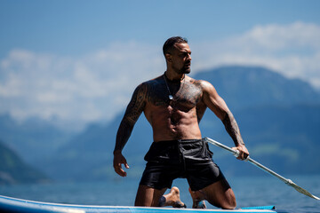 Sexy summer man. Wet muscular male body in water. Nude sexy male body. Man splash in water in...