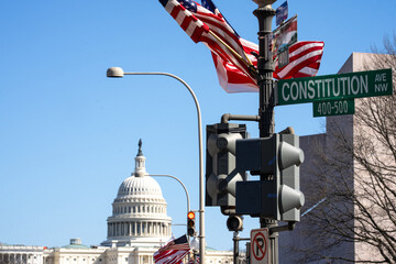 The Capitol building near Constitution street. The Constitution as symbol of the America. The...