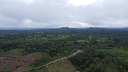 Fototapeta premium Aerial view of mountains, rivers and highways in South Kalimantan