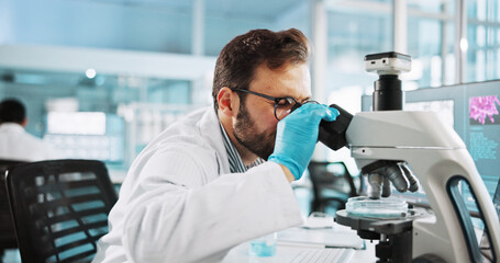 Microscope, clinic and research with man in laboratory for dna sample, forensics investigation and...