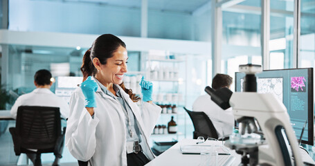 Fototapeta premium Scientist, woman and microscope with celebration for biology, breakthrough or medical research analysis. Biotech, laboratory and excited with DNA study for pharmaceutical RNA or pathology experiment
