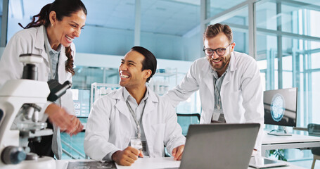Fototapeta premium Team, happy scientist and people in lab for cure discovery, breakthrough or innovation discussion. Science worker, medical collaboration and laptop with test results, healthcare research and laugh