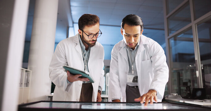 Scientist, men and screen with meeting for data review, medical research or innovation. Computer table, interactive display and clinical analysis for science, study and teamwork or tablet results