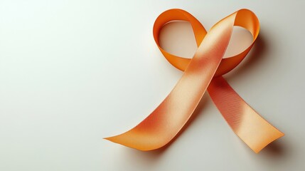 Orange Ribbon Twisted Into Heart Symbol on White Backdrop for Awareness and Healthcare