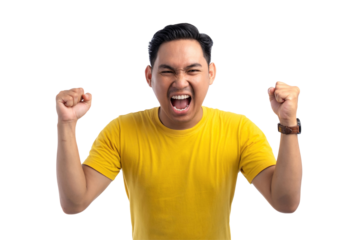 Excited handsome Asian man doing winner gesture with arms raised, shouting, celebrating success isolated on transparent background