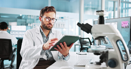 Scientist, man and research with tablet at lab with writing, review and medical notes for pharma...