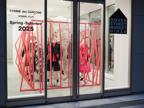 TOKYO, JAPAN - April 7, 2025: A Comme des Garcons display in the window of Dover Street Market Ginza.