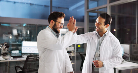 Scientist, men and high five with celebration at laboratory, smile and goals with medical research, cheers and breakthrough. People, partnership and happy with success, innovation and cure for virus