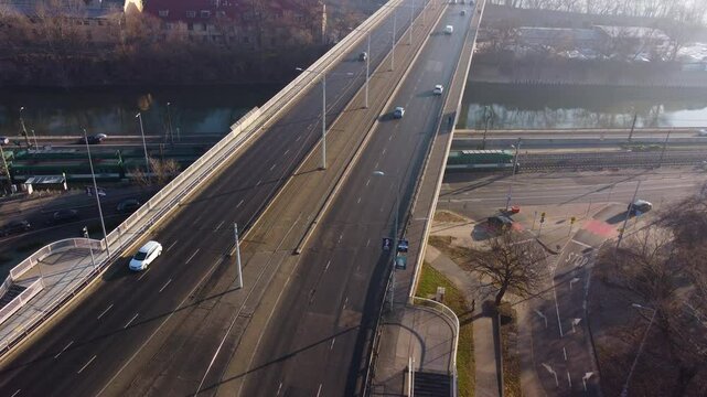 Drone shows Budapest&rsquo;s bus interchange and traffic lanes near &Aacute;rp&aacute;d Bridge at dusk