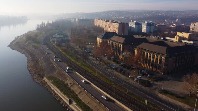 Drone flight captures Budapest bridge and surrounding buildings at golden hour twilight light