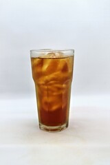Unsweetened iced tea, known as Es Teh Tawar in Indonesia. A simple, refreshing drink served cold with ice cubes—perfect for cleansing the palate on a hot day.