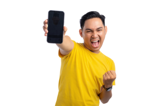 Excited young Asian man celebrating and showing smartphone screen with a victory gesture isolated on transparent background
