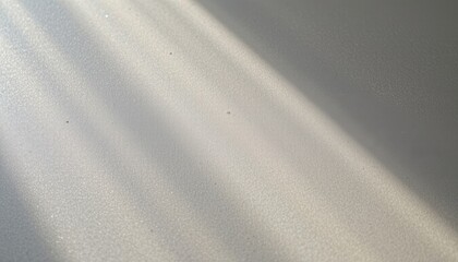 A smooth, reflective surface with a subtle texture capturing soft hues.