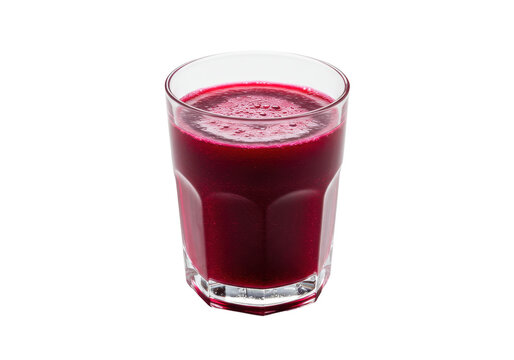 Freshly poured vibrant beetroot juice in a clear glass, isolated on white background