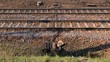 Parallel Railway Track with Electric Cables and Train Sensor on Crushed Rock Ballast