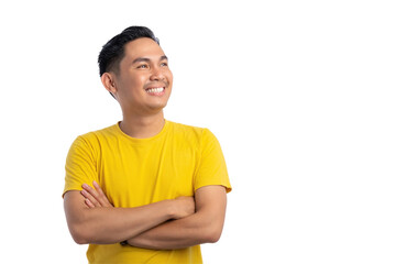 Handsome young Asian man standing with crossed arms, looking aside with a confident smile isolated on transparent background