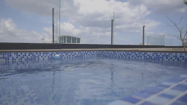 shot of a jacuzzi in an apartment with city background on sunny day with beautiful blue sky, Canon eos r, 8bits color, C-log HD