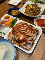 Jokbal, a Korean dish of braised pork hock, slow-cooked in a rich, savory sauce with soy, garlic, and spices. Tender and flavorful, it’s often served with lettuce wraps, garlic, and ssamjang