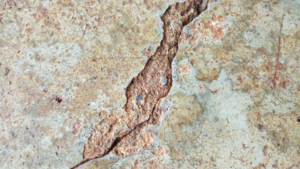 The old cement floor has cracks.