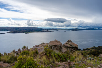 View of Lake Titicaca from Amantani Island under stormy clouds