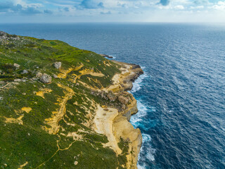 Drone view of rocks and waves. Mediterranean sea. Malta
