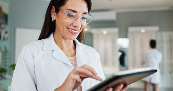 Smile, woman and optician on tablet for eye care, medical treatment or check eyesight test results. Digital technology, optometrist or store for ophthalmology research, healthy vision or prescription