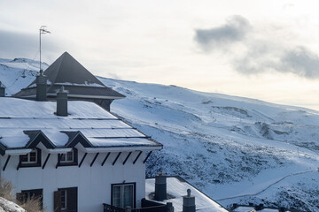 Snow-Covered House with Majestic Sierra Nevada Mountain in the Background