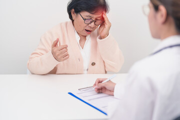 Senior Woman having headache and consulting doctor to disease. Elderly health patient, Medical...
