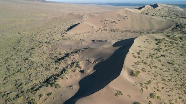 Sand dune ridge captured from above on a clear day.