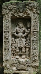 Obraz premium Ancient Carving of Deity Figure, Religious Iconography in a Rock Context